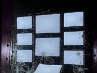 Broken window of empty real estate ads